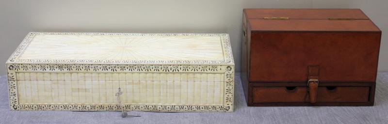 Lot of 2 Decorative Boxes.: Includes a bone veneered box and a leather desk style box. From a Flushing NY location. Dimensions: bone box -26" w x 10.5" d x 6" h; leather box -15" w x 8.5" d x 9.5" h. Condition: Good.