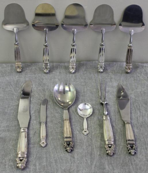 STERLING. Miscellaneous Georg Jensen "Acorn": Flatware. Includes 5 cheese servers, a butter knife, a child's spoon, a carving set, a salad spoon, and a knife. Total approximate weight of child's spoon is 0.8 troy oz. All remaining items with stai