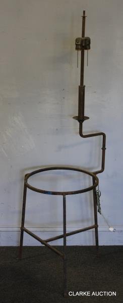 Midcentury Iron Side Table as Floor Lamp.: Attributed to Tommi Parzinger. Missing glass insert for table top. From a Greenwich, CT estate. Dimensions: 19" w x 55.5" h. Condition: Black paint losses and surface rust overall. Structurally good.