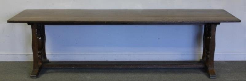 Large Turn of the Century Oak Trestle Table.: A great size table. From a New Rochelle, NY home. Dimensions: 9' wide x 2' 9" x 29.5" high. Condition: Split to one end of table top.