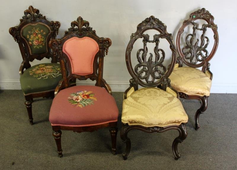 2 Pairs of Carved Victorian Chairs: From a Connecticut estate. Dimensions: the needlepoint pair are 20"w x 21"d x 39.5" high and the pair with yellow upholstery are 18"w x 19"d x 40" high. Condition: Good