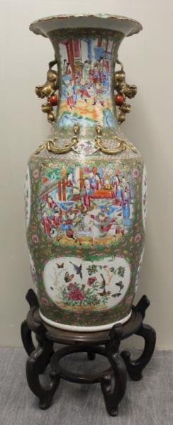 Impressive Rose Mandarin Floor Vase.: With typical decoration including court scenes, bird and butterflies, etc. Further embellished with gilded foo dogs and lizards. On a modern stand. From a Connecticut estate. Dimensions: 13.5" diamete