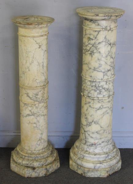 Two Antique Alabaster Column Pedestals.: From a New York City estate. Dimensions: 40" high and 42" high. Condition: Both pedestals with missing tops, and chips.