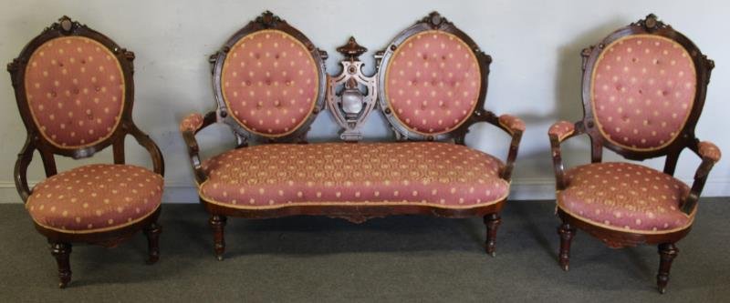 Victorian Renaissance Revival Walnut Parlor Set.: Includes double back settee and his and her chairs. From a Larchmont, NY estate. Dimensions: settee - 66" w x 30" d x 43" h. Condition: Minor bumps, scrapes, small loss to arm support, repair to on ar