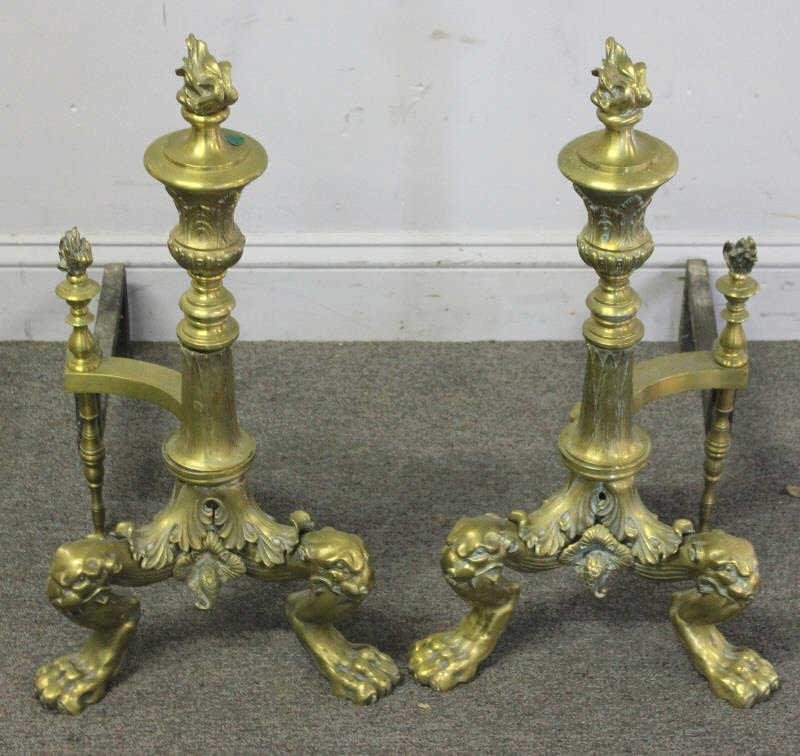 Pair of Gilt Bronze Andirons with Claw Feet and: Flame Finials. From a Connecticut estate. Dimensions: 12.5" wide x 24" x 23.5" high.