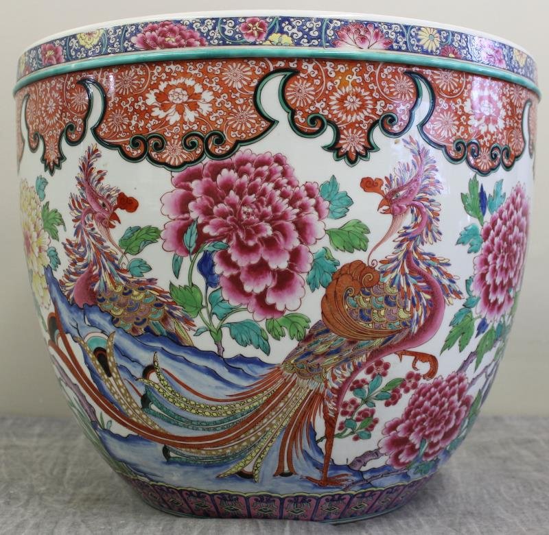 Chinese Enamel Decorated Jardiniere.: With beautiful Phoenix and floral motif. From a Rye, NY estate. Dimensions: 16.75" diameter x 13.75" high. Condition: Top rim unglazed - possibly ground or sanded down.