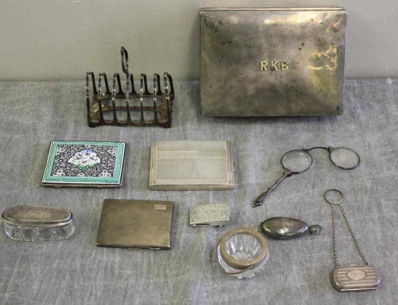 STERLING. Miscellaneous English Silver Group.: Includes a Black Starr & Frost for Gorham cigar box with monogram on lid; an enameled cigarette case; a cut crystal vanity box with English sterling lid; an English silver cigarette case, an .800 silv