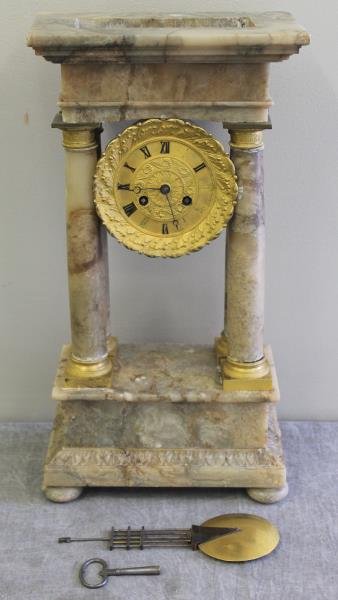 19th Century Alabaster Portico or Column Clock.: With gilt bronze. From a Westchester, NY estate. Dimensions: 10.5" w x 6.25" d x 20" h.