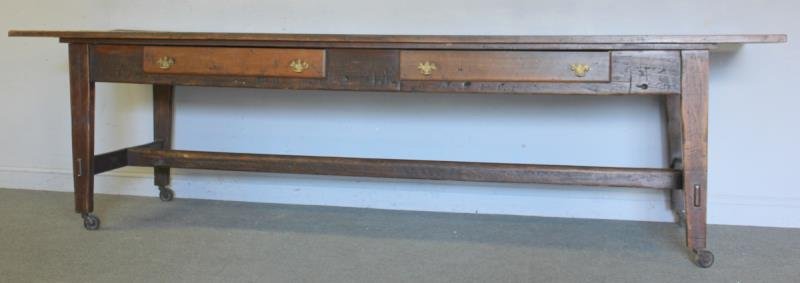 Large Vintage Farm Table.: 3 board top with mortise and tenon stretcher base. 3 drawers. Late 19th or early 20th century example. Large original casters. Dimensions: 10' w x 35.25' d x 33.25" h. Condition: Good antique conditio