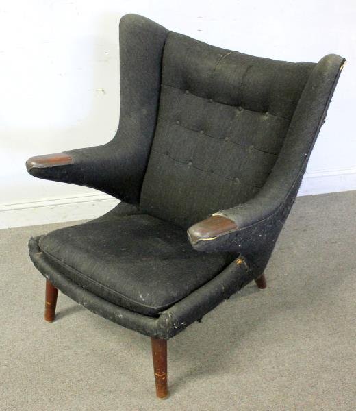 Midcentury Hans Wegner Papa Bear Chair.: Stamped Hans Wegner, A.P., Copenhagen. Upholstered in black fabric. From a Long Island, NY estate. Dimensions: 36.5" w x 36" d x 49" h. Condition: Upholstery with splits and wear near arms and lower s