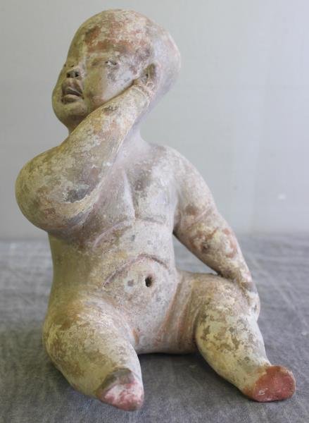 Antique Chinese Terracotta Figure of a Boy.: Probably authentic Han Dynasty. Retains a good amount of original white pigment. From a Briarcliff Manor, NY home. Dimensions: 5.675" w x 6.25" d x 9.125" h. Condition: Areas of foot missing; probable