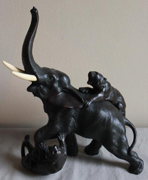 Japanese Bronze Sculpture of an Elephant Fighting: Off Predators. From a West 57th St. NYC estate. Dimensions: 15" high x 12" wide. Condition: Good.