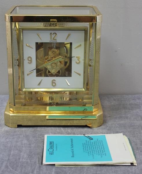 Unusual Jaeger Le Coultre Atmos Clock.: With engraved glass. Serial # 285144. Accompanied with related and unrelated Atmos pamphlets - including an original purchase certificate dated 1974, and a repair bill dated 1989. From a Croton, NY ho