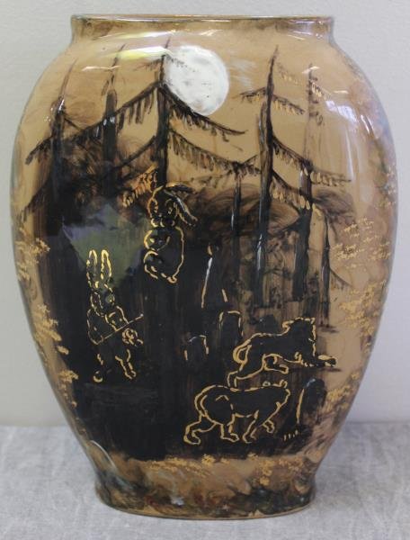 Early Rookwood Vase.: Painted and gilded with animals including a rabbit playing a violin in a moonlit escape. Marked Rookwood Pottery, and dated 1882. From a Croton, NY home. Dimensions: 8" w x 10.375" h. Condition: Good,