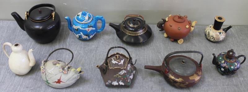 Antique/Vintage Japanese Teapots.: Including lacquer, pottery, monochromatic, Satsuma, etc. Total of 10 pieces. From a Croton, NY home. Dimensions: lacquer - 8" wide spout to spout x 9" high including the handle. Condition: One brown a