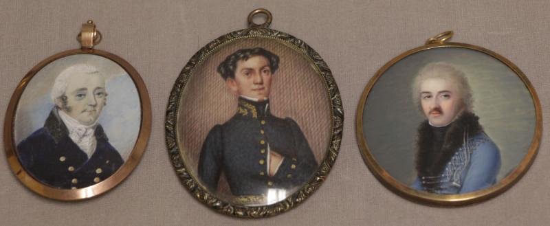 3 Portrait Miniatures of Gentlemen on Bone/Ivory.: Man in blue coat with gold buttons and white cravat set in a gilt locket frame with engine turned guilloche reverse adorned with stylized initial 'F' in seed pearls, 2 1/2" high, possible minor liftin