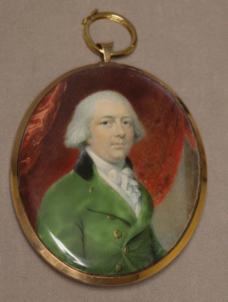 Attributed to Philip Jean, Portrait Miniature of a: Gentleman in a Green Coat with Gold Buttons. Painted on bone or ivory in a pendant frame with glazed reverse revealing two curls of hair around the seed pearl monogram 'DW'. Purchased from Elle Shusha