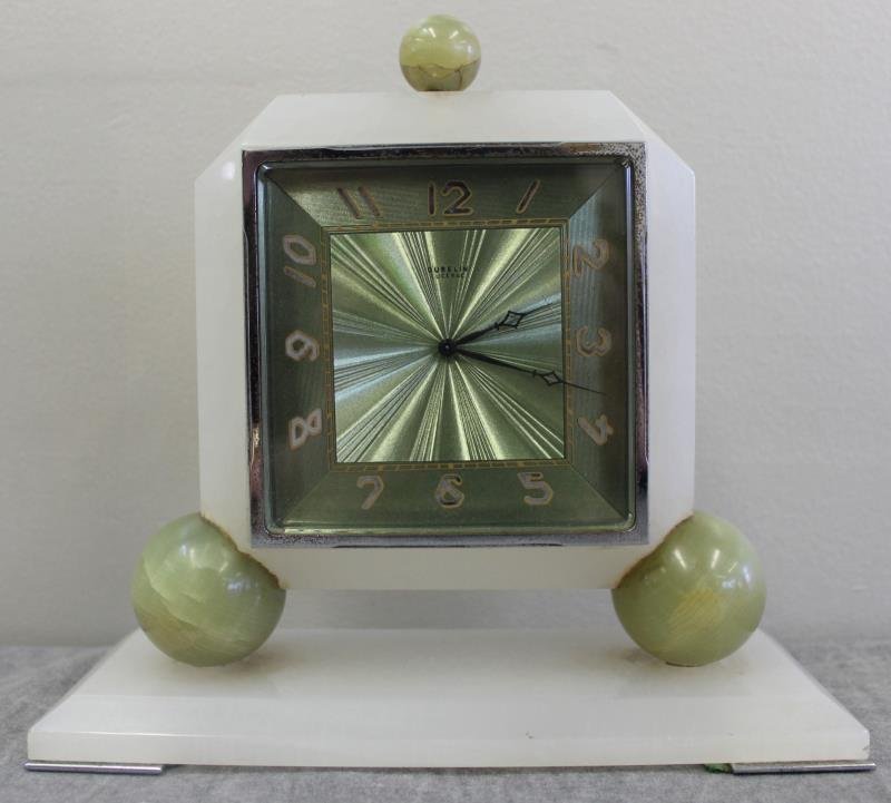 Vintage Gubelin Onyx/Alabaster Desk Clock.: Marked Gubelin on an engine turned style dial. From a Manhattan, NY estate. Dimensions: 8.375" w x 3.25" d x 7.875" h. Condition: Slight pitting to outer nickel? In running order, but all mechanical i