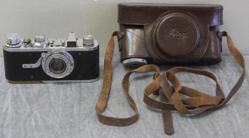 Ernst Leitz Leica Camera.: No. 11360. Circa 1928. In a brown leather Leica case. From a West 83rd St Manhattan apt. Condition: In used condition with some wear to camera case; all mechanical items sold as is.
