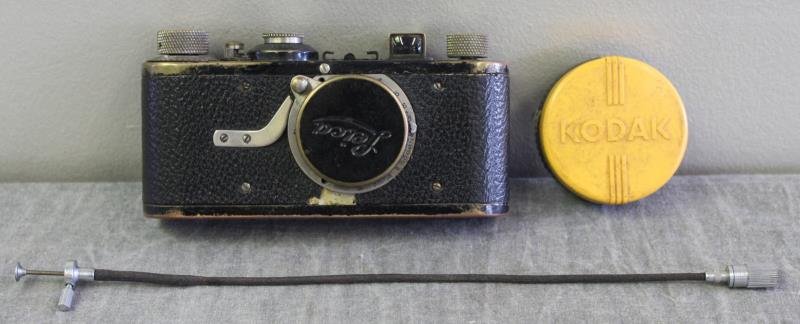Leica Camera, Serial #35034.: Accompanied by a shutter release cable, and Kodak filter. From a Yonkers, NY home. Condition: As is, brassed.