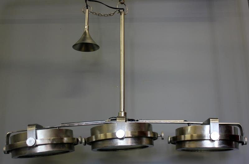 Industrial Style 3 Light Fixture.: Contemporary. From a Stamford, CT estate. Dimensions: 49" w x 17" d x 32" h. Condition: Good.