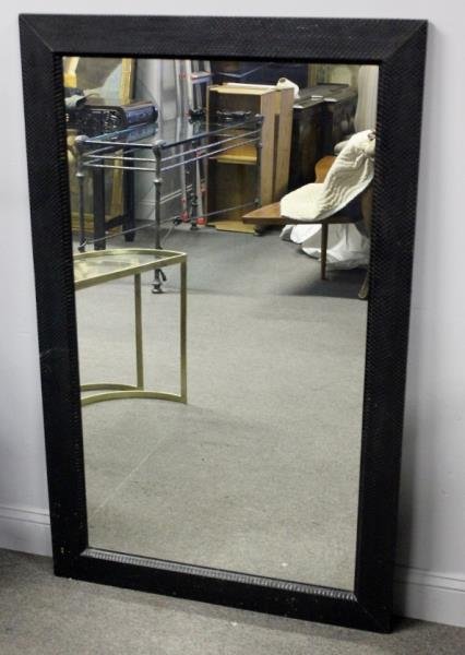 Midcentury Karl Springer Black Snakeskin Mirror.: Exquisite rectangular mirror by Karl Springer in a black snakeskin wrapped frame. From a White Plains, NY estate. Dimensions: 33" w x 53.5" h. Condition: Good with slight losses or abrasions to lower