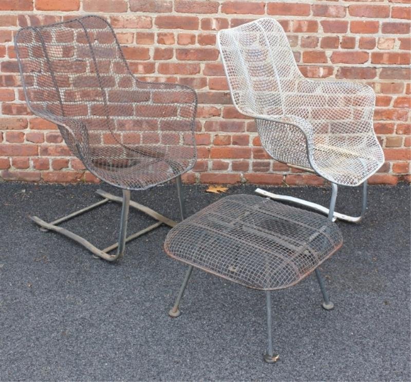 Midcentury Woodard Scultura Chairs and Ottoman.: Includes 2 wire mesh and sculpted rocking chairs, one black and one white, together with a black wire mesh ottoman. From a Larchmont, NY estate. Condition: Good. Dimensions: Ottoman - 15" h x 22" w x 