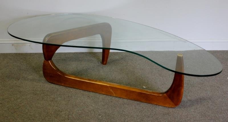 Midcentury Oversized Noguchi Style Coffee Table.: Organic form glass top. One elongated base leg. Brass pin. From a Queens, NY estate. Dimensions: 65" w x 37" d x 16" h. Condition: Superficial abrasions / minor wear to base.