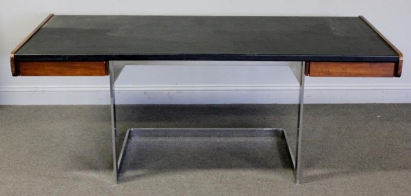 Midcentury Ste Marie-Laurent Rosewood and Chrome: Desk. Designed by Andre Laurent. Labeled to drawer interior. Leather top with two drawers. From a Long Island, NY estate. Dimensions: 74" w x 32" d x 27.5" h. Condition: Some scrapes and abrasions to