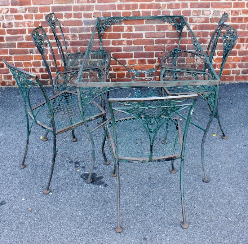 Vintage Wrought Iron Outdoor Dining Set.: Set includes 6 chairs and a rectangular table. No glass. By Woodard. From a Larchmont, NY estate. Dimensions: 60.5" x 32.5" x 29" high, chairs 29" x 24.5" x 37.5" high.