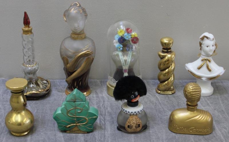 Vintage Perfume Bottle Lot.: Includes Golli-Wogg, Schiaperelli Shocking, Schiaperelli Seces Fou, Ondil Elizabeth Arden frosted figural, Hattie Carnegie Carnegie Bleu figural, Gilbert Orcel figural, and a Schiaperelli candle form.