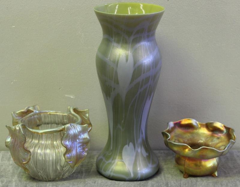 Art Glass and Tiffany Lot.: Includes a signed L.C.T. ruffled bowl on feet, an unmarked Tiffany style iridescent vase with big leaves, and a Loetz type cased glass vase. From a Pelham, NY estate. Dimensinos: ruffled bowl - 4.5" d