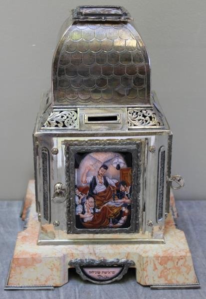 JUDAICA. Large and Impressive Sterling and Enamel: Tzedakah Box. By Yaacov Davidoff. Each of the 4 sides with an enameled plaque measuring approx. 2.675" w x 3.75" h. An additional enameled plaque on the top. Signed on the base in Hebrew and dated 200