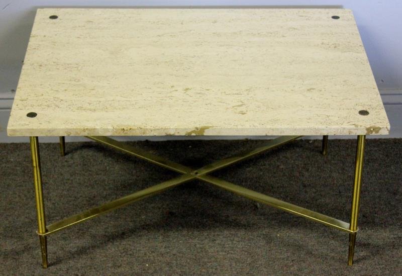 Midcentury Travertine Top and Brass Coffee Table.: Brass tapered legs and stretcher under travertine marble top. From a Manhattan, NY location. Dimensions: 28" w x 20" d x 14.5" h. Condition: Slight chip to one corner.
