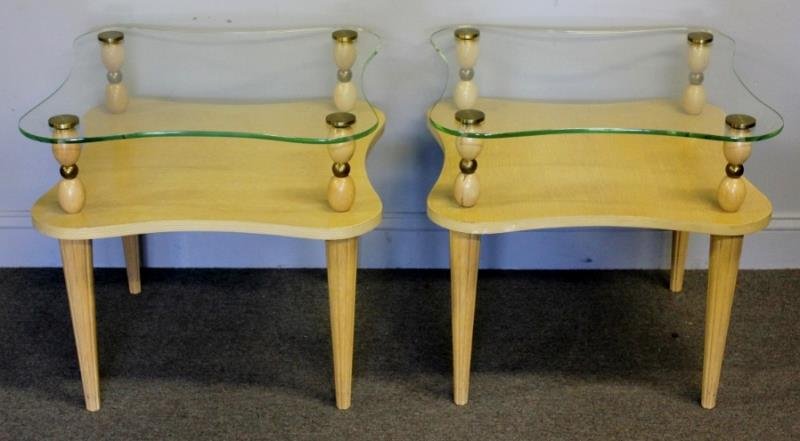Midcentury Pair of Gilbert Rohde End Tables.: Two tier with elevated glass top. Tapered legs. Unmarked. From a Queens, NY estate. Dimensions: 23.25" w x 23.25" d x 22.25" h. Condition: Good with some wear.