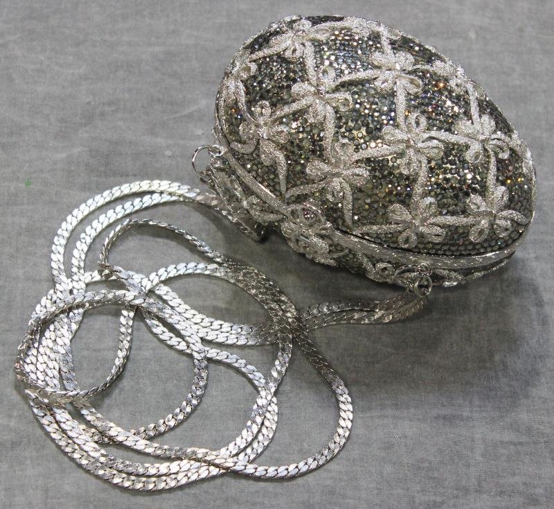 Judith Leiber Rhinestone Egg-shaped Evening Bag.: With interlaced bow form design, and crystal rhinestones, double chain strap, and bow form closure. Signed on the interior, "Judith Leiber," "Saks Fifth Avenue," and, "Saks Fifth Avenue By Judith Leib