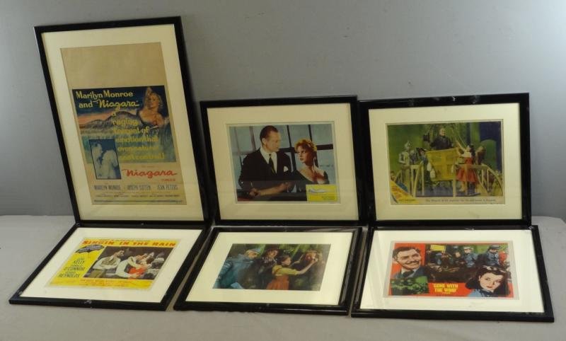 Collection of 6 Lobby Cards.: "The Wizard Of Oz" (wizard in the balloon with Tin Man, Scarecrow, Lion and Dorothy present, 49-140 reissue code lower right, some fold marks, some small tears at margins top and left), with "Niagara"