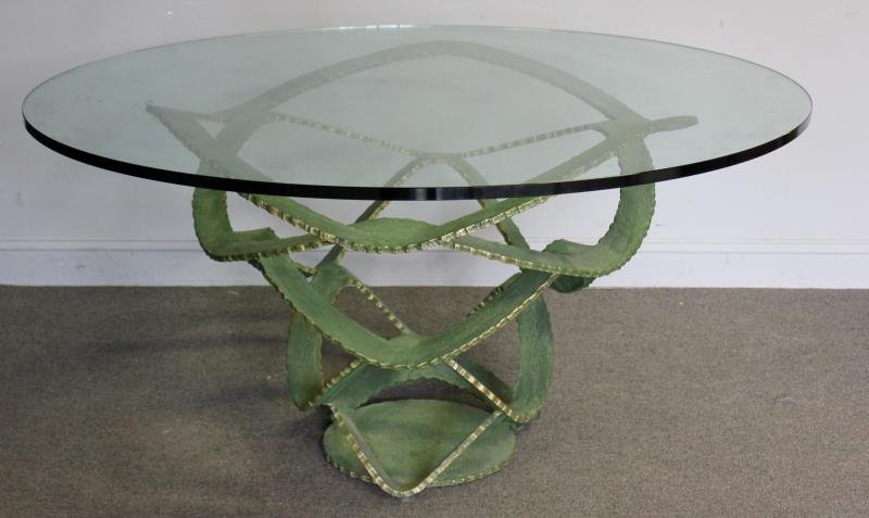 Beautiful Sculpted Steel / Bronze Center Table.: Ribbon form base with Banco Real S.A. tag. From a Manhattan, NY estate. Dimensions: 55" diameter x 34" h. Condition: Good.