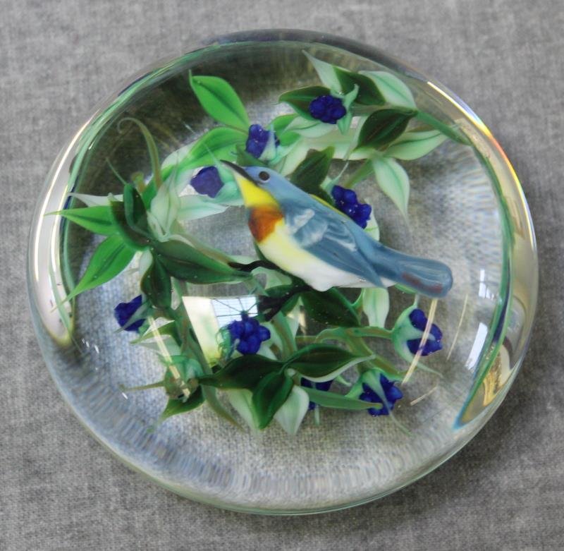 Rick Ayotte Paperweight.: Decorated with bird, berries, and leaves. Marked on the base, "Ayotte 2/25 '83." From an Ossining, NY home. Dimensions: approx. 3.25" diameter.