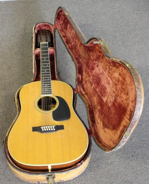 C.F. Martin & Co., 12 String Acoustic Guitar.: Model # "D 12-35". Serial # 251850. From a Larchmont, NY estate. Condition: The instrument with crackle finish on the lacquer. Line inlay in excellent condition. The back with a contrasting triangular