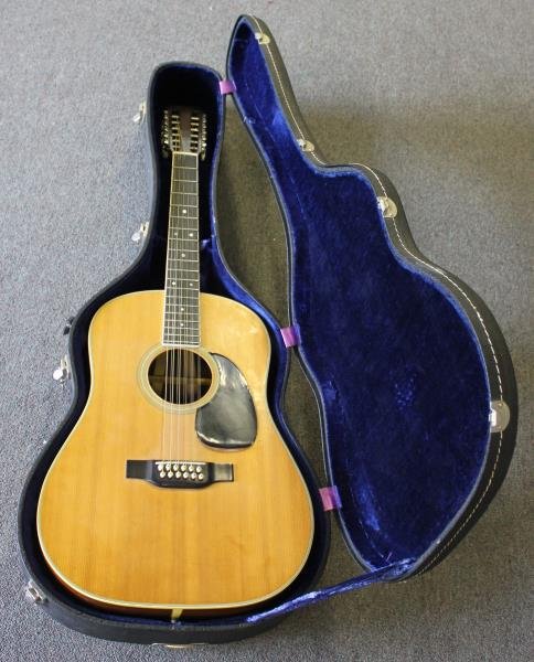 C.F. Martin & Co.12 string Acoustic Guitar.: Model # R-D #46.on the interior, also marked Property of C.F. Martin & Co. / not to be sold. From a Larchmont, NY estate. Condition: The surface in excellent condition . The concentric bulls eye inlay