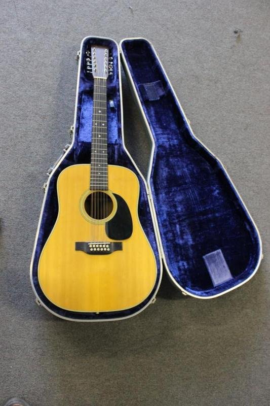 C.F. Martin & Co. 12 String Acoustic Guitar.: Model " D12-28 "Dreadnought, serial numbered 359147. From a Larchmont, NY estate. Condition: The instrument with crackle finish on the lacquer. Bullseye inlay in excellent condition. The back with a c