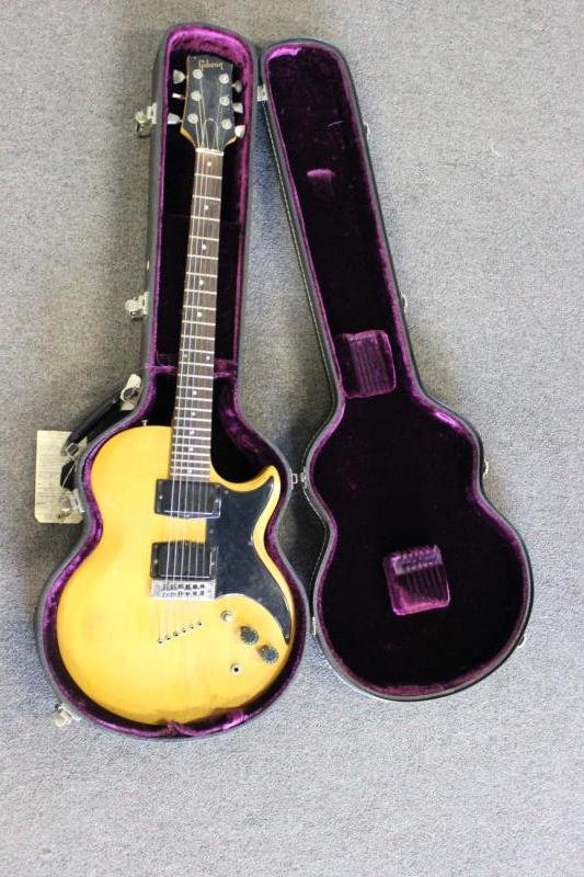 Gibson L6 DELUXE 6 String Electric Guitar.: Impressed serial # 558442 / made in USA on the back of the neck (circa 1974?). Clear volume knobs, From a Larchmont, NY estate. Condition: Surface clean, back has wear points through finish to bare wo