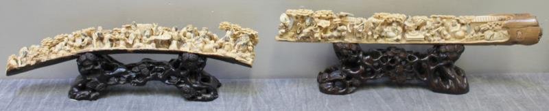 Two Antique/Vintage Asian Carvings: On carved hardwood stands. Probably Chinese. One representing an unusual subject of scroll painters, and the other with figures and a carved seal mark. One carved on front and back. From a Bedford Hil