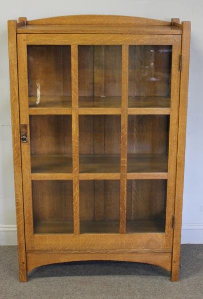 Vintage Stickley 1 Door Bookcase.: From a Bronxville, NY estate. Dimensions: 34" w x 15" d x 54.5" h. Condition: Good with one upper glass pane missing to left side.