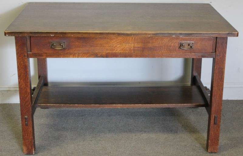 L.&J.G Stickley Mission Oak Library Table.: With one drawer. Library table or writing desk. Labeled in drawer. From a Rye Brook, NY estate. Dimensions: 48" w x 30.125" d x 29.5" h. Condition: Original. Back top edge slightly rough, areas of dry
