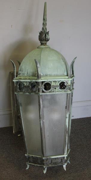 Antique / Vintage Bronze Lantern Form Fixture.: Bronze frame and backplate. Great patina. From an Irvington, NY Estate. Dimensions: Lantern alone measures 16.5" w x 16.5" d x 36.5" h. Extends 20.5" from wall overall. Condition: Weathered but good.