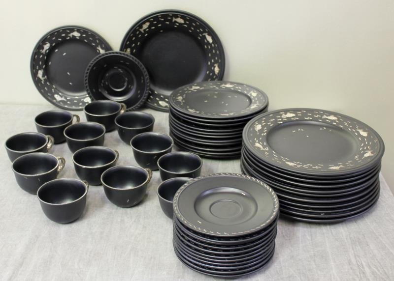 Midcentury Emilia Castillo Pottery Service.: A set of Emilia Castillo silver on black pottery dishes. Signed "Emilia Castillo/ Plata Pura/ Mexico 92/ 8" and with her cypher. The set consists of 12 dinner plates (11 3/8"), 12 salad plates (9.5"),
