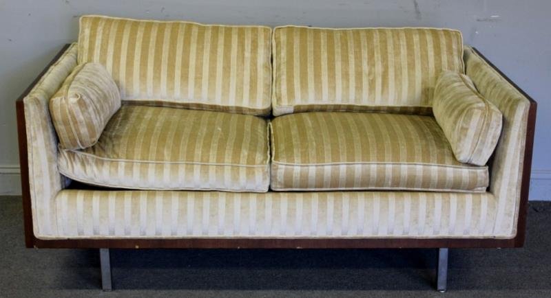 Midcentury Rosewood Case Milo Baughman Loveseat.: Unmarked. 2 seat sofa with rosewood case sides, open back, and chrome legs. From a Scarsdale, NY estate. Dimensions: 64" w x 34" d x 26.5" h. Condition: Good. With small veneer losses to left side and