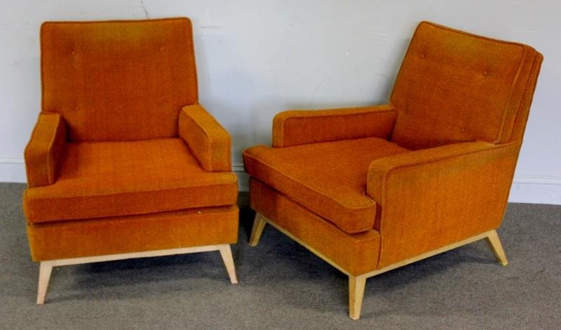 Midcentury Pair of Upholstered Lounge Chairs.: Great looking pair of probably American modern arm chairs on blondewood / birch leg bases. Old reupholster tag under cushion. From a Queens, NY estate. Dimensions: 28.5" w x 35" d x 33" h. Condition: